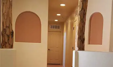 A hallway with a door and window in it